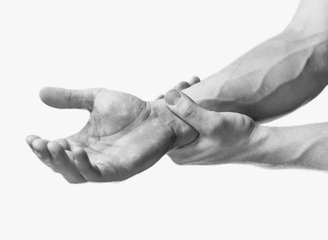 Pain in a male wrist. Man holds his hand, close-up image. Monochrome image, isolated on a white background