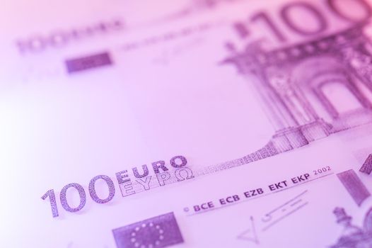 Close-up view of cash money euro bills background. Finance and business concept. Shallow depth of field.