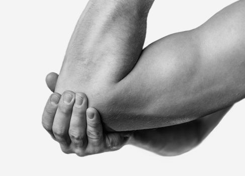 The man is touching the elbow due to acute pain. Monochrome image, isolated on a white background