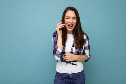 Photo shot of cute nice charming gorgeous attractive pretty youngster happy woman wearing stylish clothes isolated over colorful background with copy space and having fun.