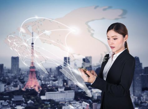 woman using smartphone with world social media network connection