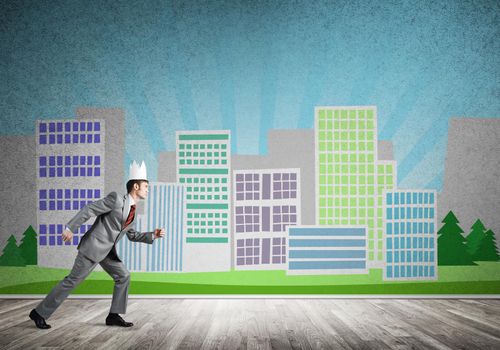Young handsome businessman wearing white paper crown running in a hurry