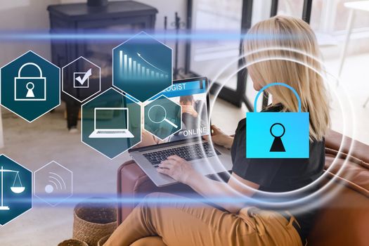 Businesswoman with laptop, desktop at office interior, blue glowing information protection icons. Padlock and business data symbols. Concept of cyber security and data storage