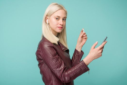 Tula, Russia - May 1, 2019: Happy woman listening music Apple AirPods wireless - Image