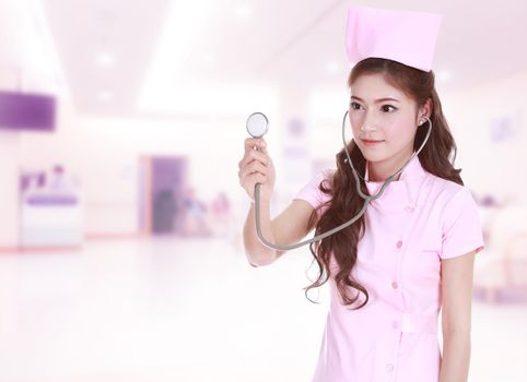 female nurse with stethoscope in hospital background