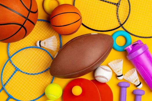 Composition of various sport equipment for fitness and games. Close up.