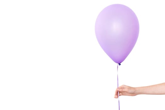 Womans hand holds purple balloon white background isolated