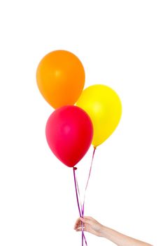 Womans hand holds balloons in a white background isolated