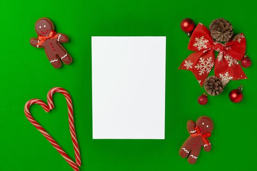 Blank Christmas greeting card with festive decorations, top view