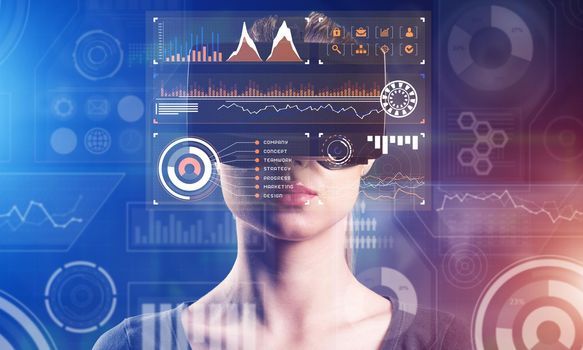 Young attractive woman in VR glasses. Immersion in the virtual world.