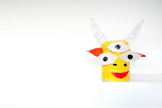 Homemade paper head of a fairy mythical creature on a white background