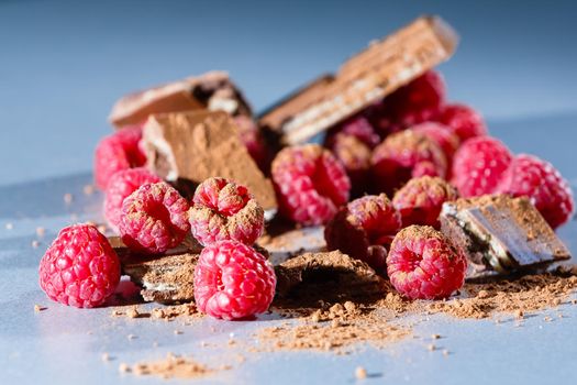 red Raspberry fruit on gray background chocolate