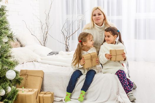 mother and children at home for christmas.