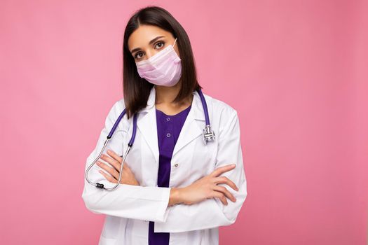 Covid19, coronavirus, healthcare and doctors concept. Portrait of professional confident young european doctor in medical mask and white coat, stethoscope over neck.