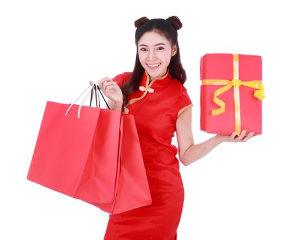 happy woman holding shopping bag and red gift box in concept chinese new year celebration isolated on a white background