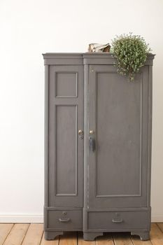 Gray old vintage cupboard in white interior. Wooden wardrobe Architecture, Interiors of empty apartment, room with wardrobe