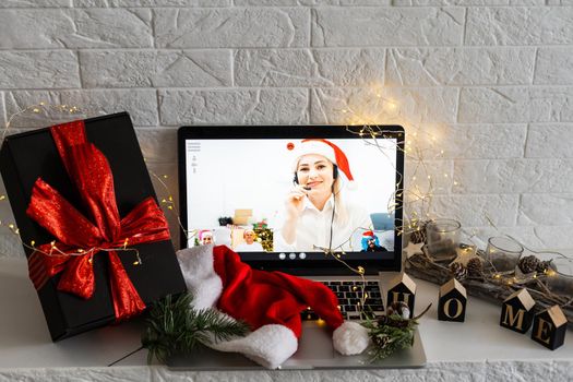 video call celebrating christmas by laptop online during coronavirus outbreak.