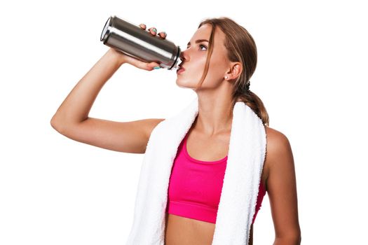 Portrait of sporty young woman tired after a gym workout. Woman with a white towel and a bottle of water isolated on white background