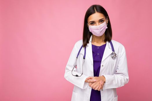 Covid19, coronavirus, healthcare and doctors concept. Photo of professional confident young european doctor in medical mask and white coat, stethoscope over neck, ready help patient, fight disease. Copy space