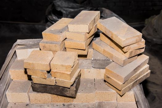 A bunch of refractory bricks, fire-resistant brick blocks.