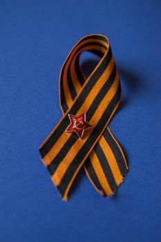 Tver Russia-may 9, 2020: 75 years of Victory in the great Patriotic war. St. George ribbon for 75 years of victory on a blue background. Happy Victory Day Space for text.