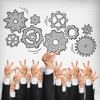 Group of hands of businesspeople showing gestures on wooden background