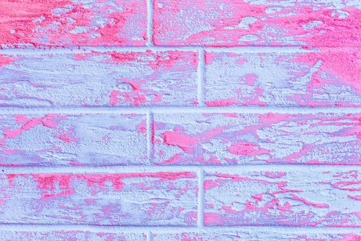 Pink or purple and light blue abstract paint pattern surface brick wall texture background.