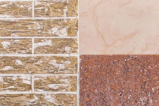 Part of modern building facade with beige and brown tiles texture and brick wall with abstract patterned background.