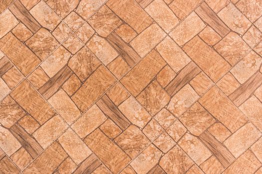 Brown tile floor with abstract pattern of stone texture background, top view.