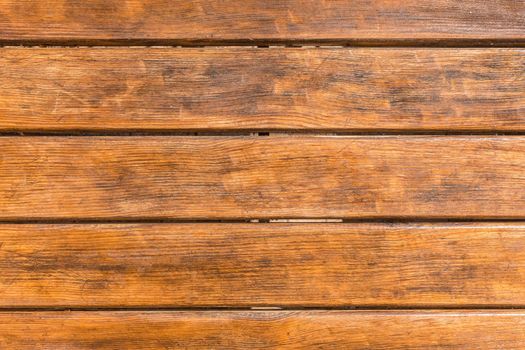 Horizontal old brown planks table texture background, top view.