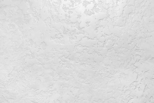 Modern white plaster wall with abstract pattern surface texture background.