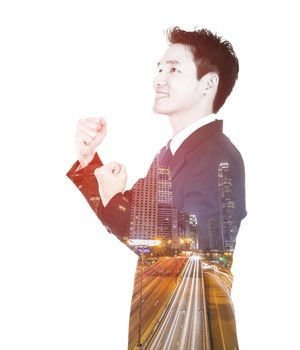 Double exposure of winning businessman against the city isolated on white background