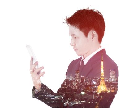 Double exposure of businessman using the tablet against the city isolated on white background