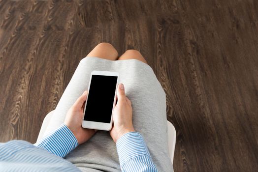 close-up of female hands with a phone