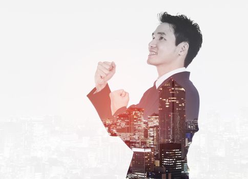 Double exposure of winning businessman against the city