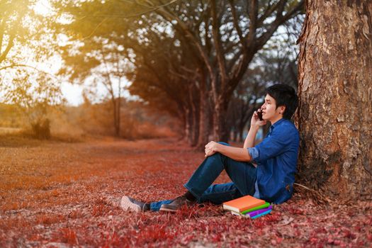 man talking on mobile phone in the park