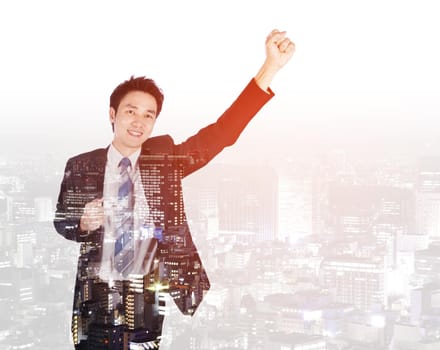 double exposure of success businessman keeping arms raised with a city background