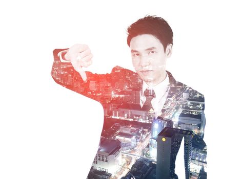 Double exposure of business man showing thumbs down gesture against the city isolated on white background