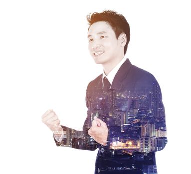 Double exposure of winning businessman against the city isolated on white background