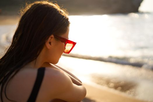 woman in a black swimsuit on the beach sea Summer vacation. High quality photo