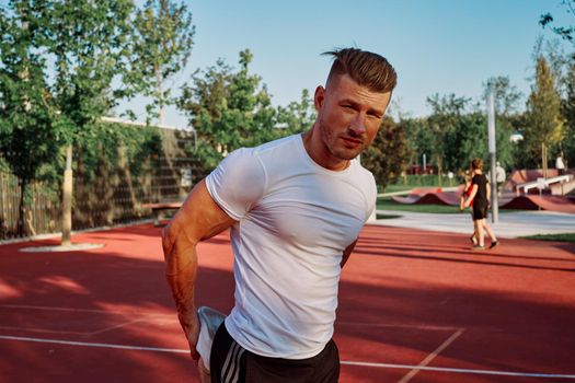 man doing exercises outdoors on the playground. High quality photo