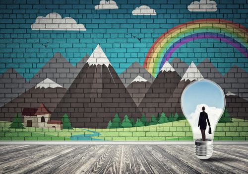 Businesswoman inside light bulb in room against nature drawn concept