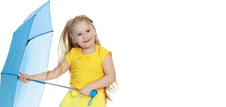 A lovely little round-faced blonde girl, with very long beautiful hair, in short skirts and yellow jerseys.She holds a blue umbrella in her hands.Isolated on white background.