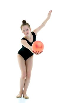 Beautiful little girl gymnast performs exercises with the ball. The concept of children's sports, fitness. Isolated on white background.