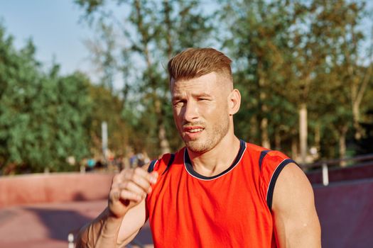 sports man on the playground in the park workout. High quality photo