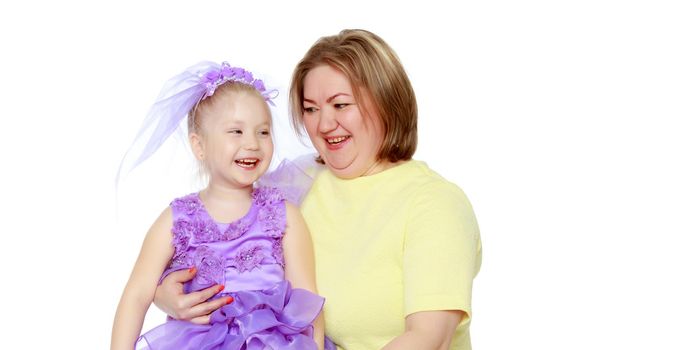 Young blonde mother, gently hugs her favorite little round-faced daughter. Family Idyll.Isolated on white background.