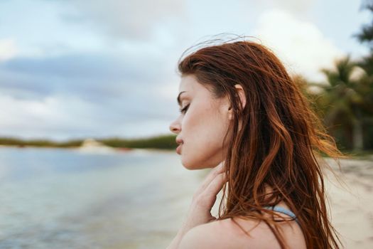 woman in blue swimsuit on the beach island lifestyle. High quality photo