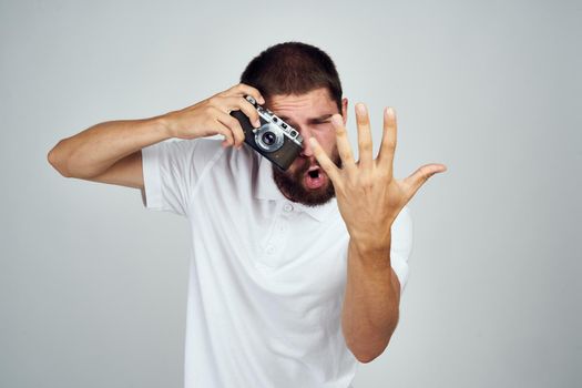 male photographer in glasses with a camera professionals modern style. High quality photo