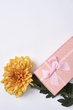 pink gift box flower bouquet holiday light background. High quality photo