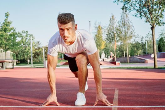 man doing exercises outdoors on the playground. High quality photo